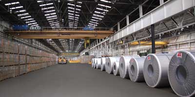 Steel in warehouse with crane and truck