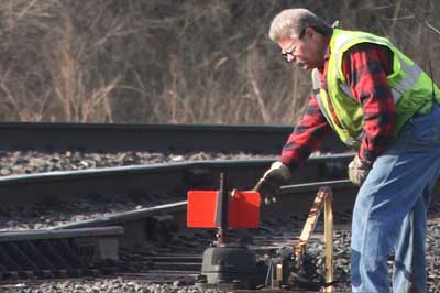 CSX rail worker switching tracks